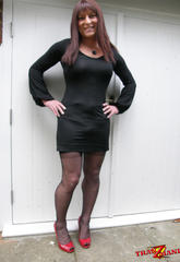 Libidinous long haired crossdresser with large smile