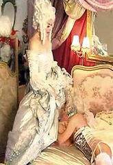 Kim dressed as a victorian madame and sucks some cockkim