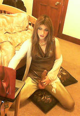 Kirsty has a excited gold outfit on and she is giving a