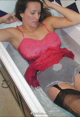 Jane gets in the bath in all her lingeriejane gets in the