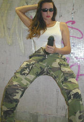 Posing down a dark alley in camo with hard straponposing