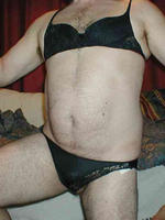 Crossdresser in tight nylon panties and sexy bra with a
